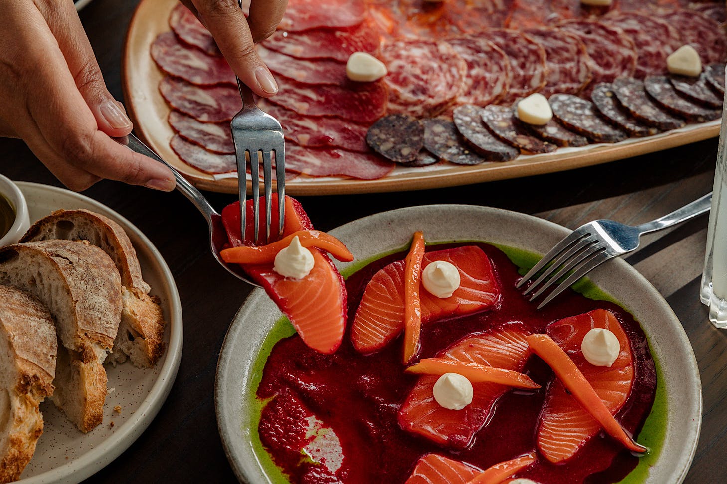 Hungry punters reach for some gorgeous seafood bites at MoVida.